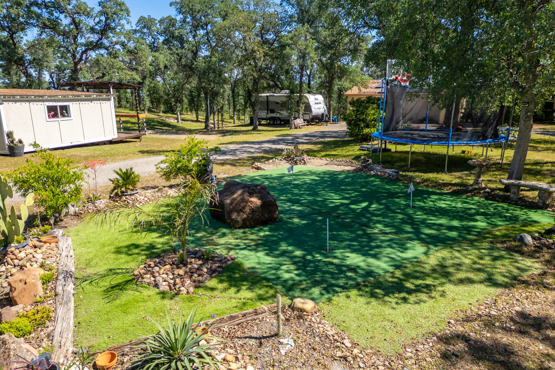 21100 Doe Run Way Red Bluff, CA 96080 - Photo 53 of 93 a view of a house with swimming pool and a yard