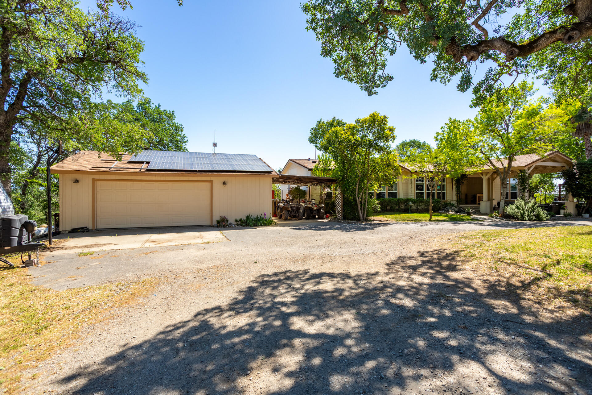 21100 Doe Run Way Red Bluff, CA 96080 - Photo 56 of 93 a view of a house with a yard and garage