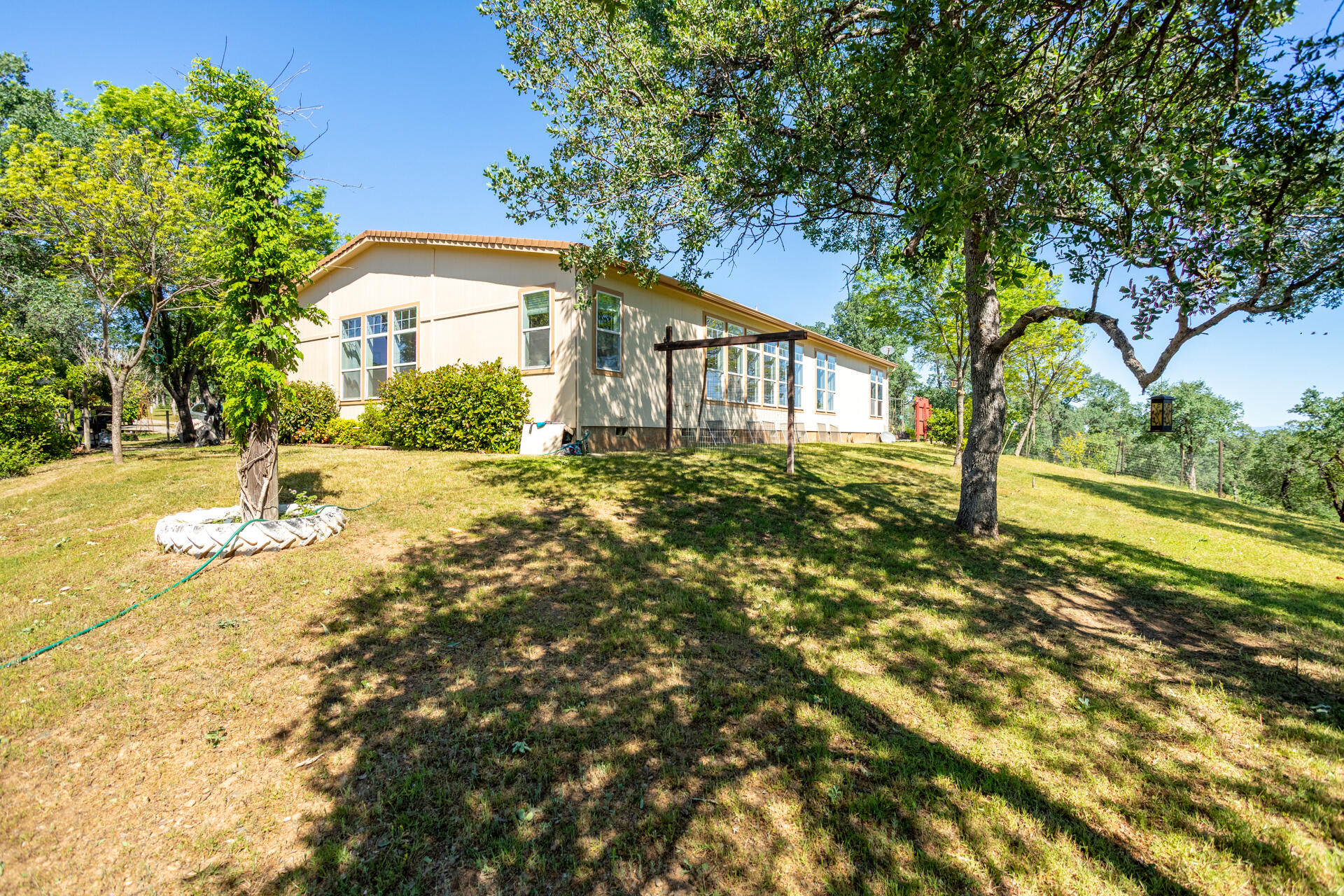 21100 Doe Run Way Red Bluff, CA 96080 - Photo 57 of 93 a front view of a house with a yard