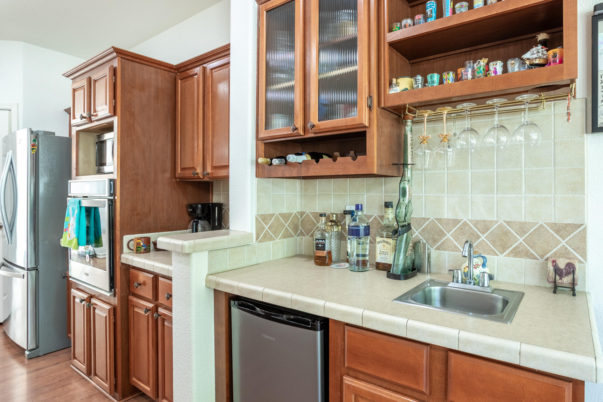 21100 Doe Run Way Red Bluff, CA 96080 - Photo 9 of 93 a kitchen with stainless steel appliances a sink and a refrigerator