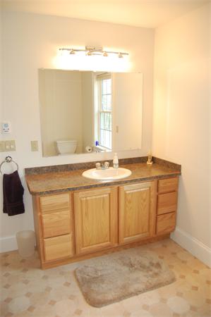 49 Old Gilbertville Road Ware, MA 01082 - Photo 15 of 25 a bathroom with a sink vanity and a mirror