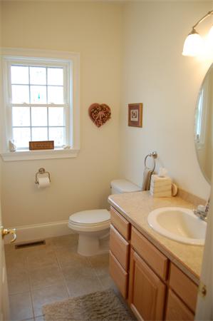 49 Old Gilbertville Road Ware, MA 01082 - Photo 9 of 25 a bathroom with a sink a toilet and a window