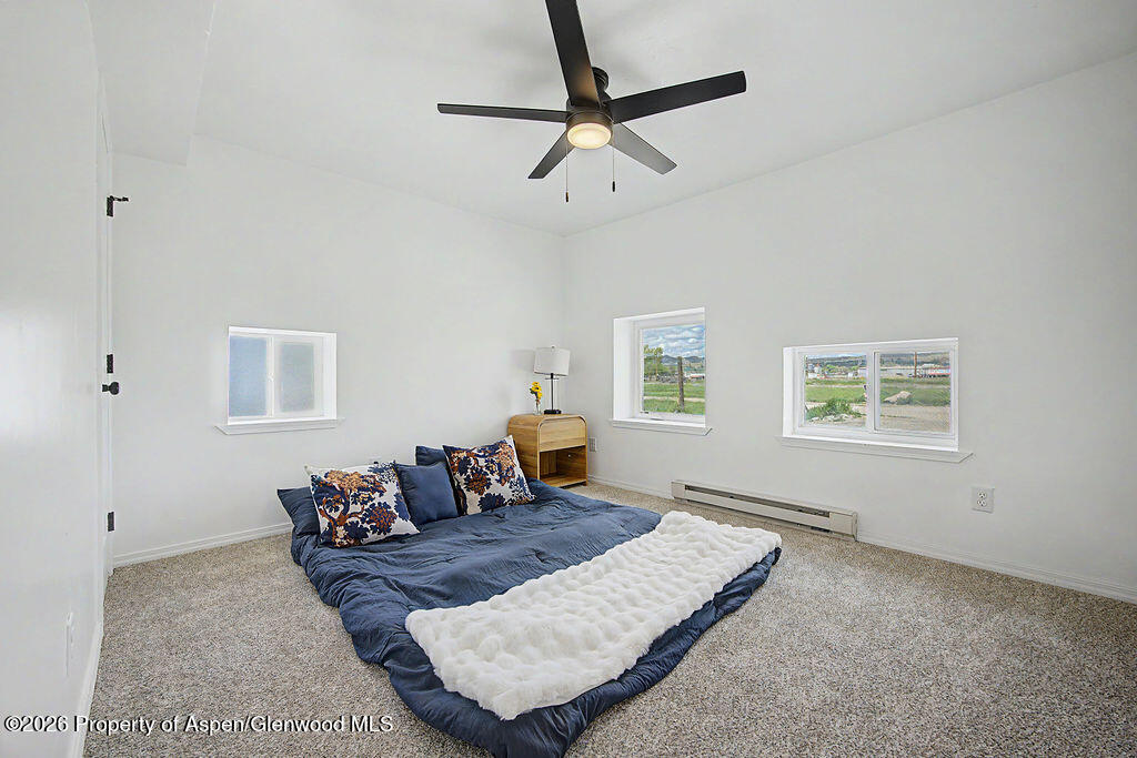 54 South Ranney Street Craig, CO 81625 - Photo 9 of 32 a living room with furniture rug and window