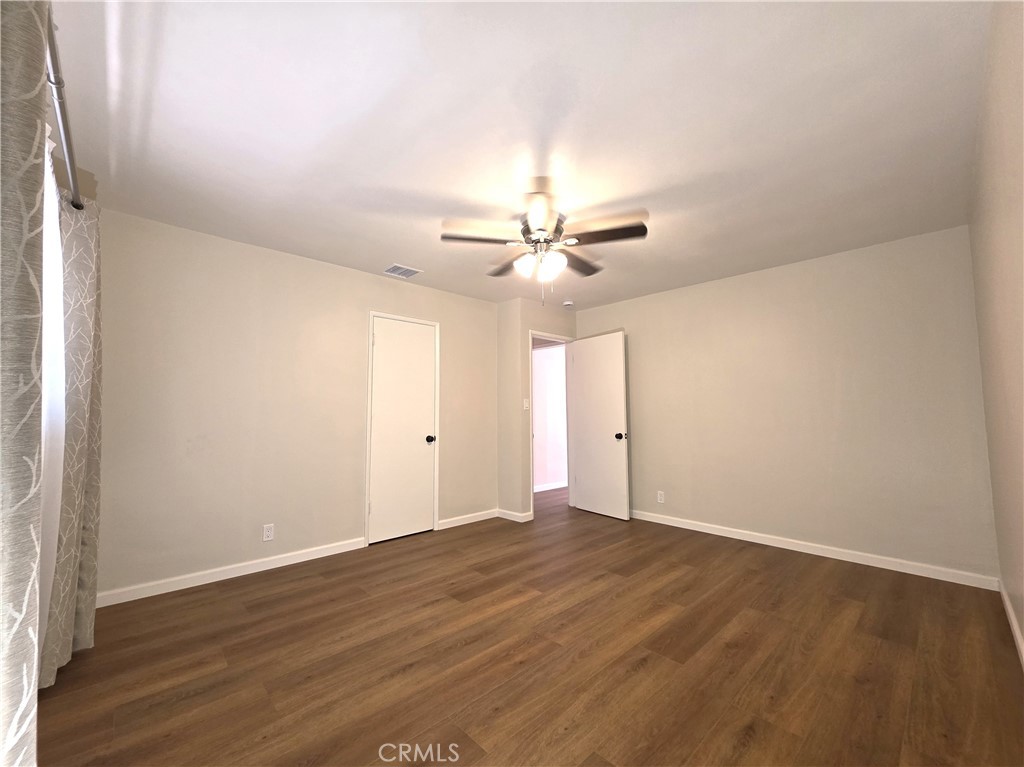 868 Random Lane Duarte, CA 91010 - Photo 11 of 22 a view of an empty room with wooden floor