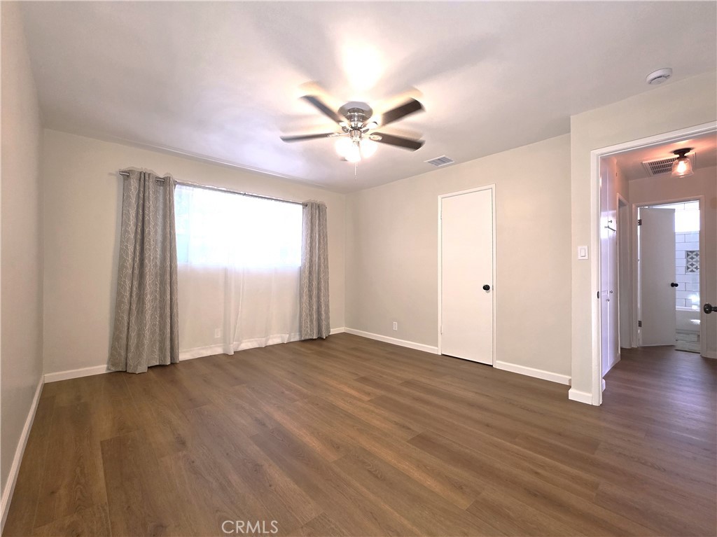 868 Random Lane Duarte, CA 91010 - Photo 12 of 22 a view of an empty room with window and a ceiling fan