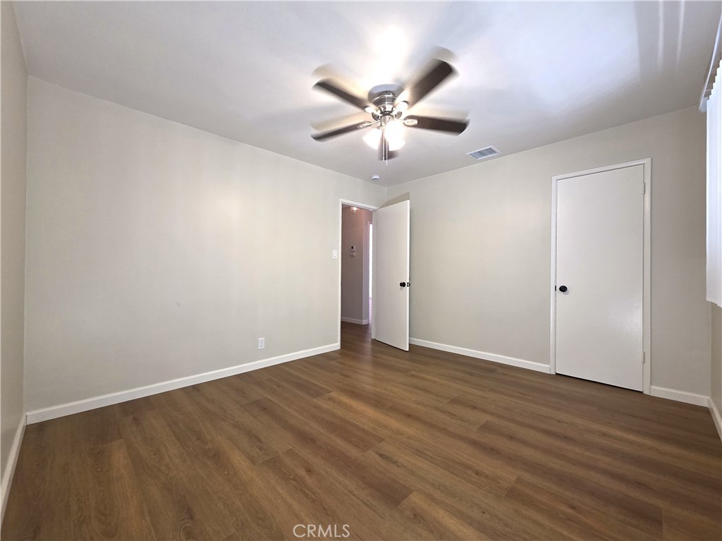 868 Random Lane Duarte, CA 91010 - Photo 13 of 22 a view of an empty room with wooden floor