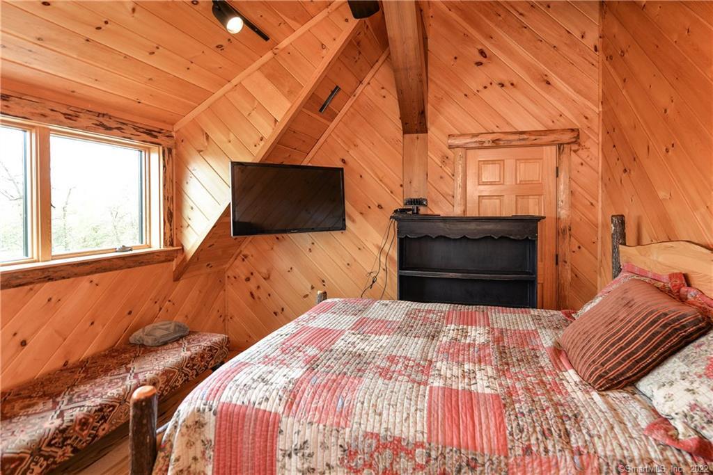 555 West Purchase Road Southbury, CT 06488 - Photo 14 of 15 a bedroom with a bed and wooden floor