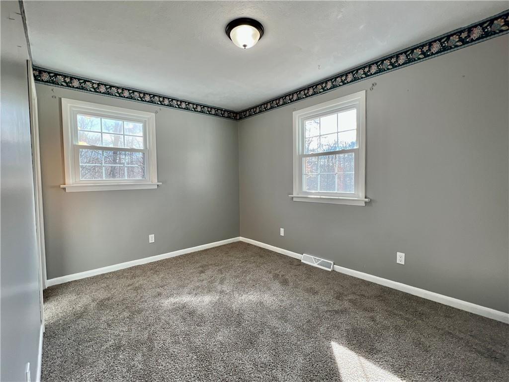 97 Dean Road Sandy Lake, PA 16145 - Photo 15 of 25 a view of an empty room with a window