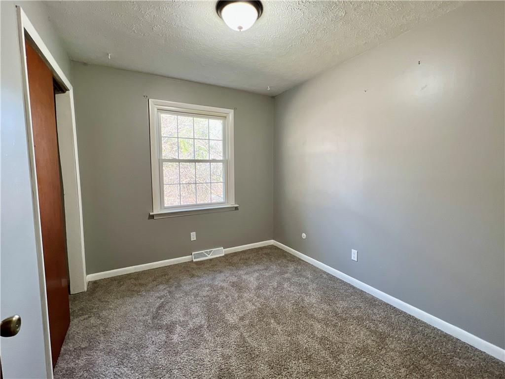 97 Dean Road Sandy Lake, PA 16145 - Photo 16 of 25 an empty room with windows
