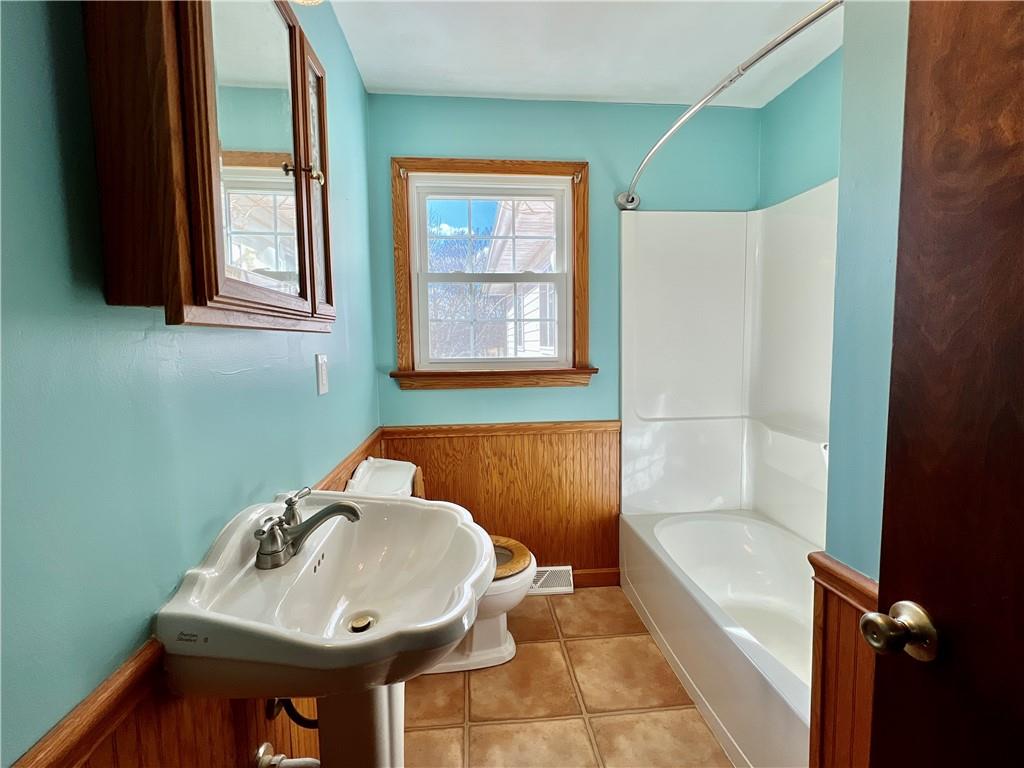 97 Dean Road Sandy Lake, PA 16145 - Photo 18 of 25 a bathroom with a sink and a bathtub