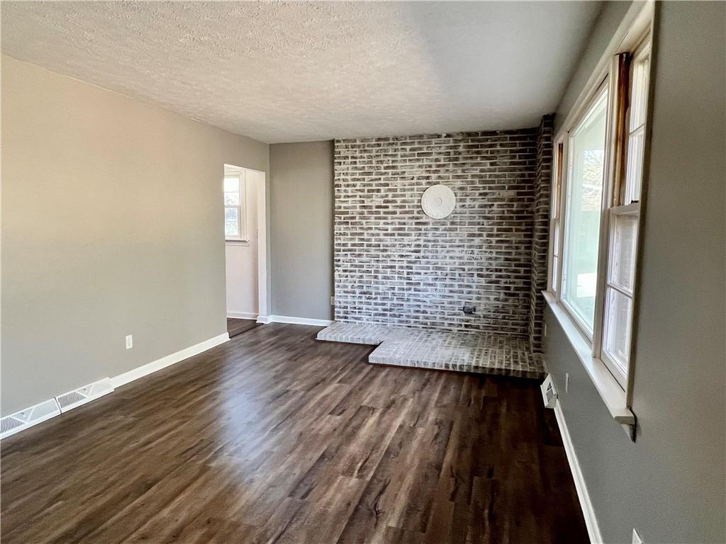 97 Dean Road Sandy Lake, PA 16145 - Photo 21 of 25 wooden floor in an empty room with a window