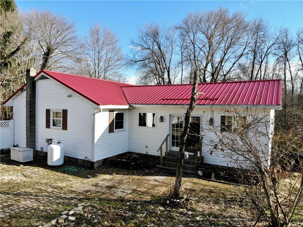 97 Dean Road Sandy Lake, PA 16145 - Photo 23 of 25 a front view of a house with a yard