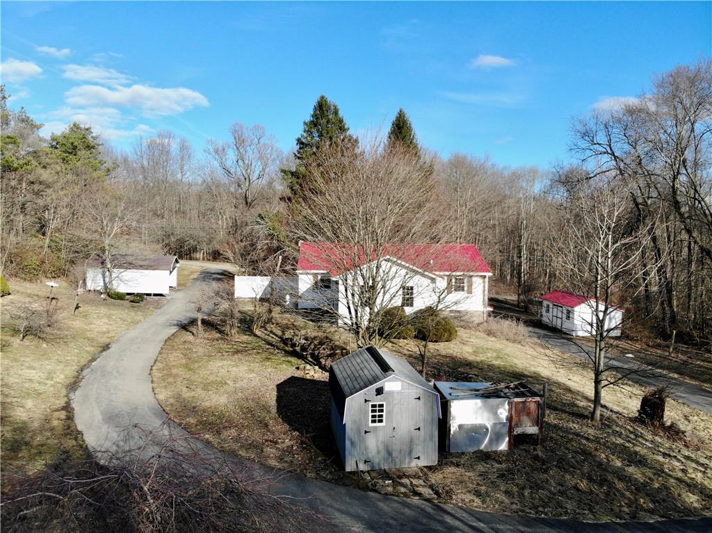 97 Dean Road Sandy Lake, PA 16145 - Photo 24 of 25 a view of a house with a yard