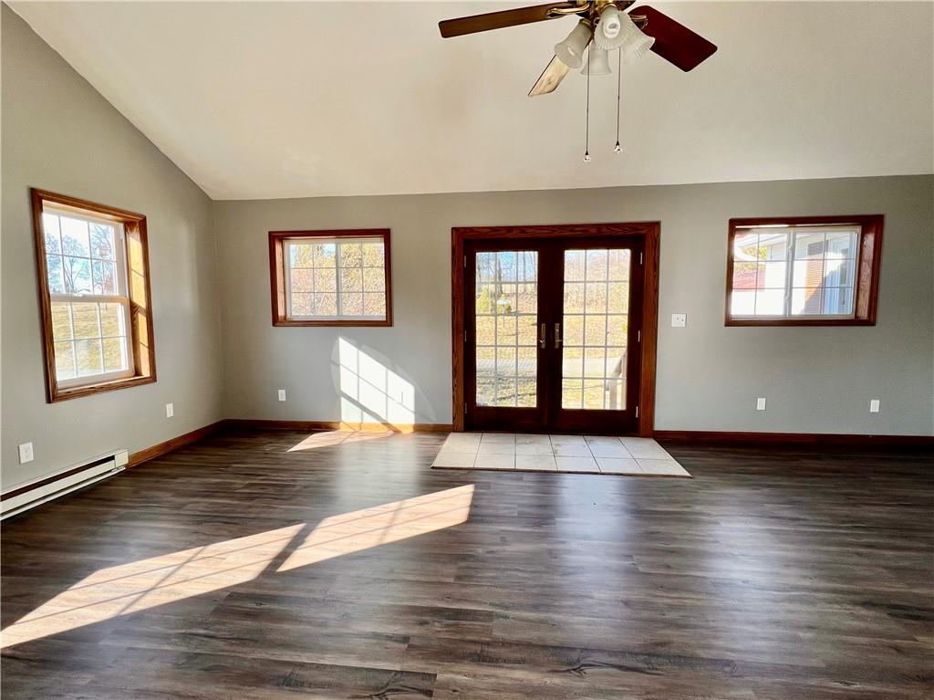 97 Dean Road Sandy Lake, PA 16145 - Photo 3 of 25 an empty room with wooden floor chandelier and windows