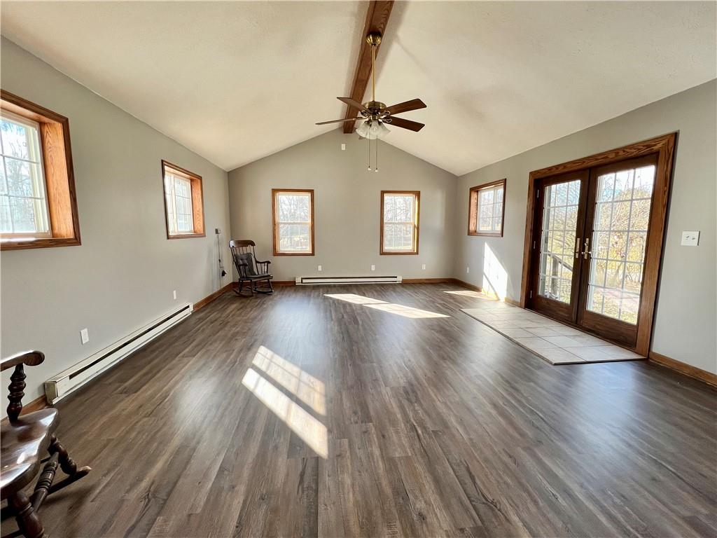 97 Dean Road Sandy Lake, PA 16145 - Photo 4 of 25 a view of an empty room with wooden floor and a window