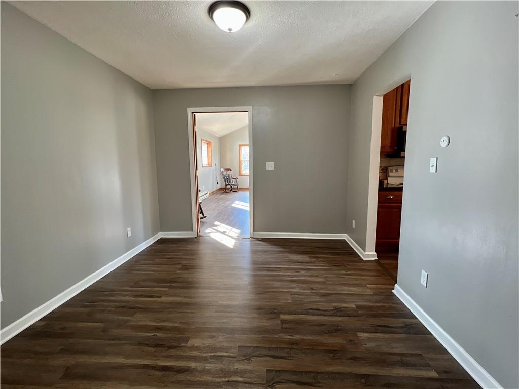 97 Dean Road Sandy Lake, PA 16145 - Photo 5 of 25 a view of an empty room with wooden floor and closet