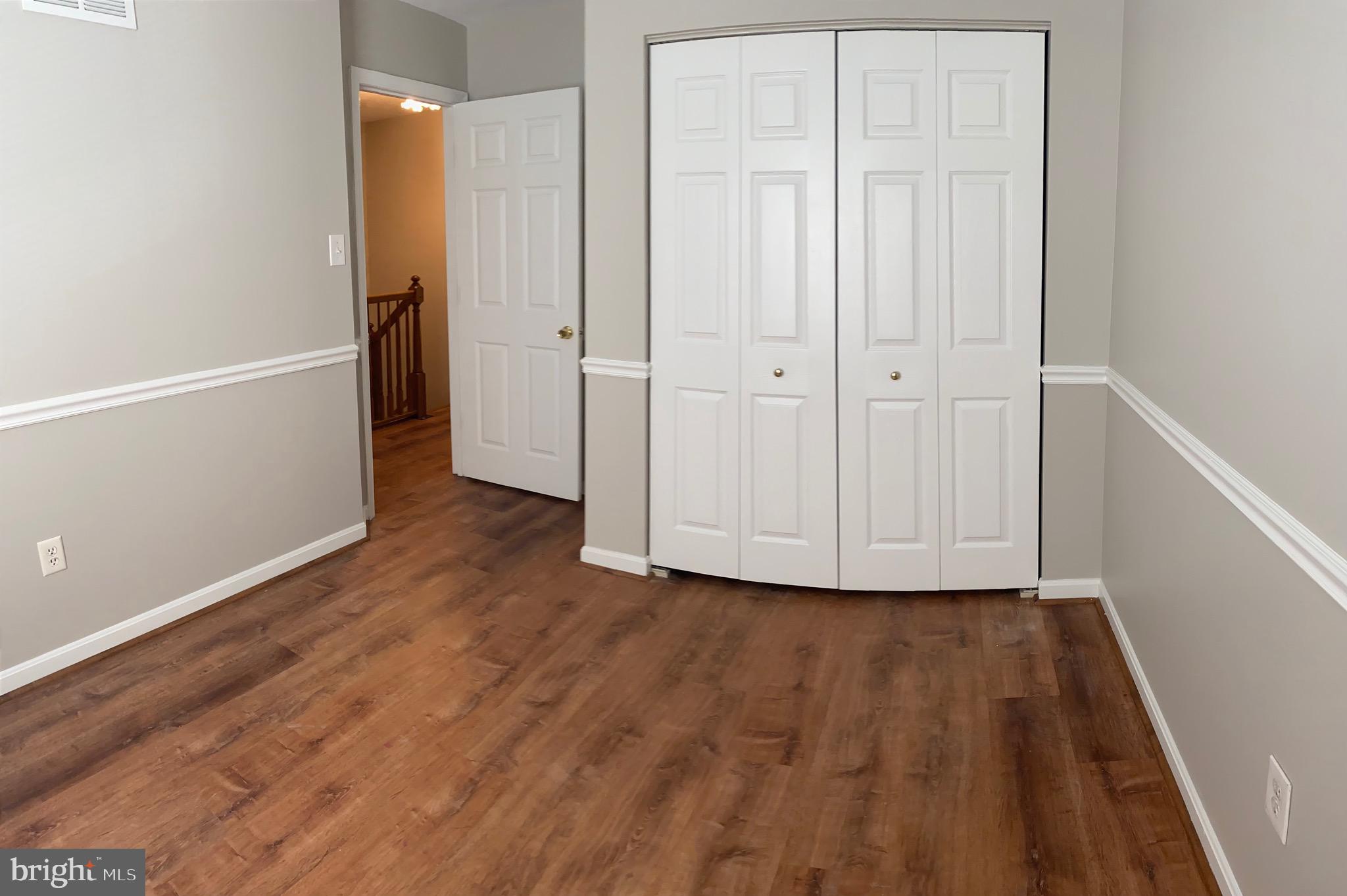 1216 Heathfield Road Eldersburg, MD 21784 - Photo 13 of 26 a view of a hallway with wooden floor