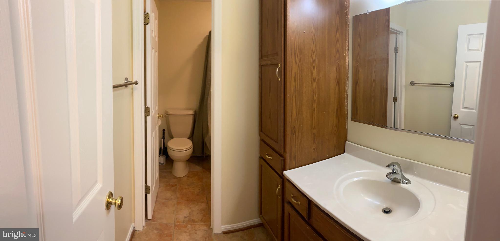 1216 Heathfield Road Eldersburg, MD 21784 - Photo 14 of 26 a bathroom with a sink vanity and a mirror