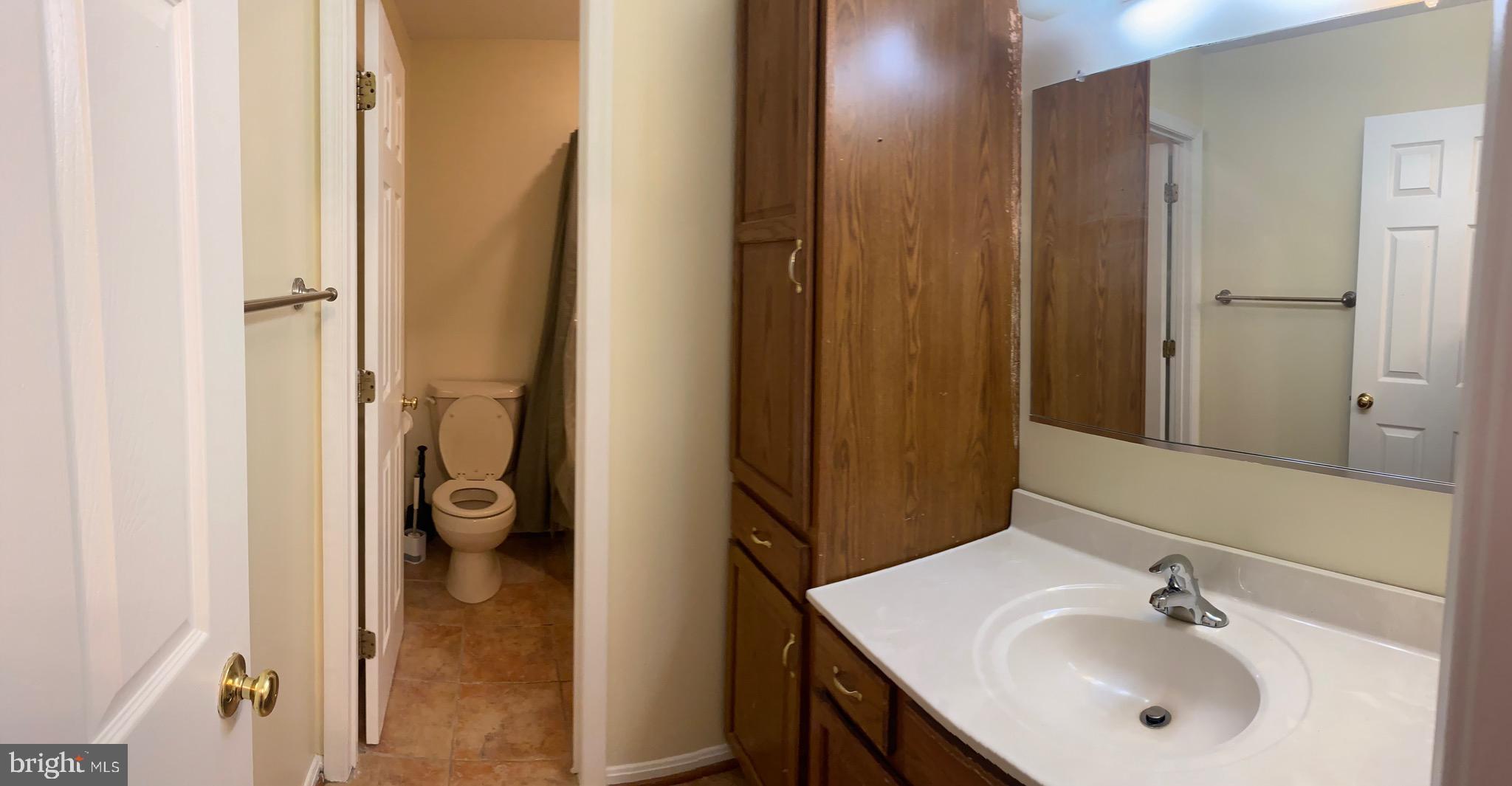 1216 Heathfield Road Eldersburg, MD 21784 - Photo 16 of 26 a bathroom with a sink and a mirror