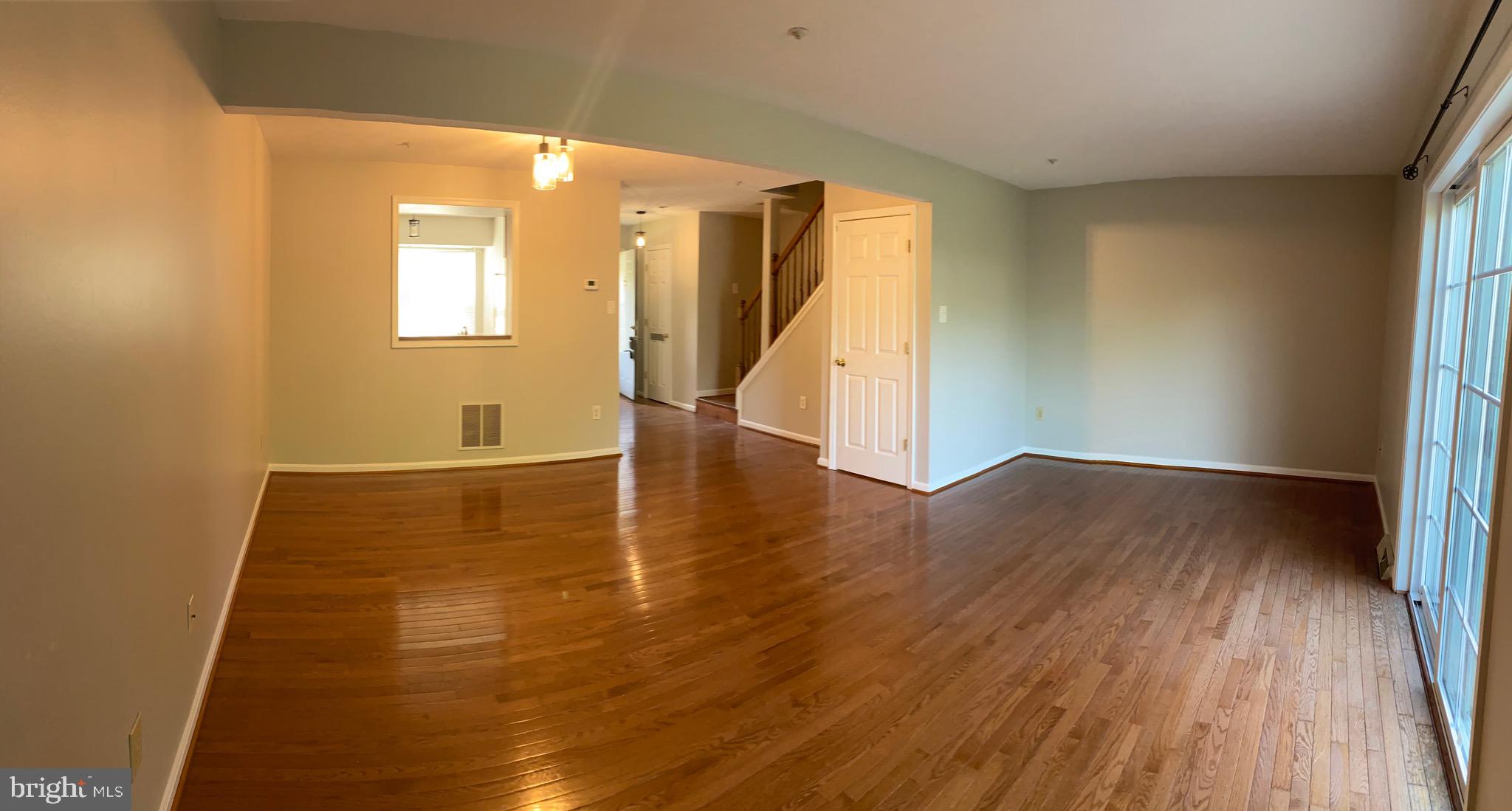 1216 Heathfield Road Eldersburg, MD 21784 - Photo 2 of 26 wooden floor in an empty room with a window