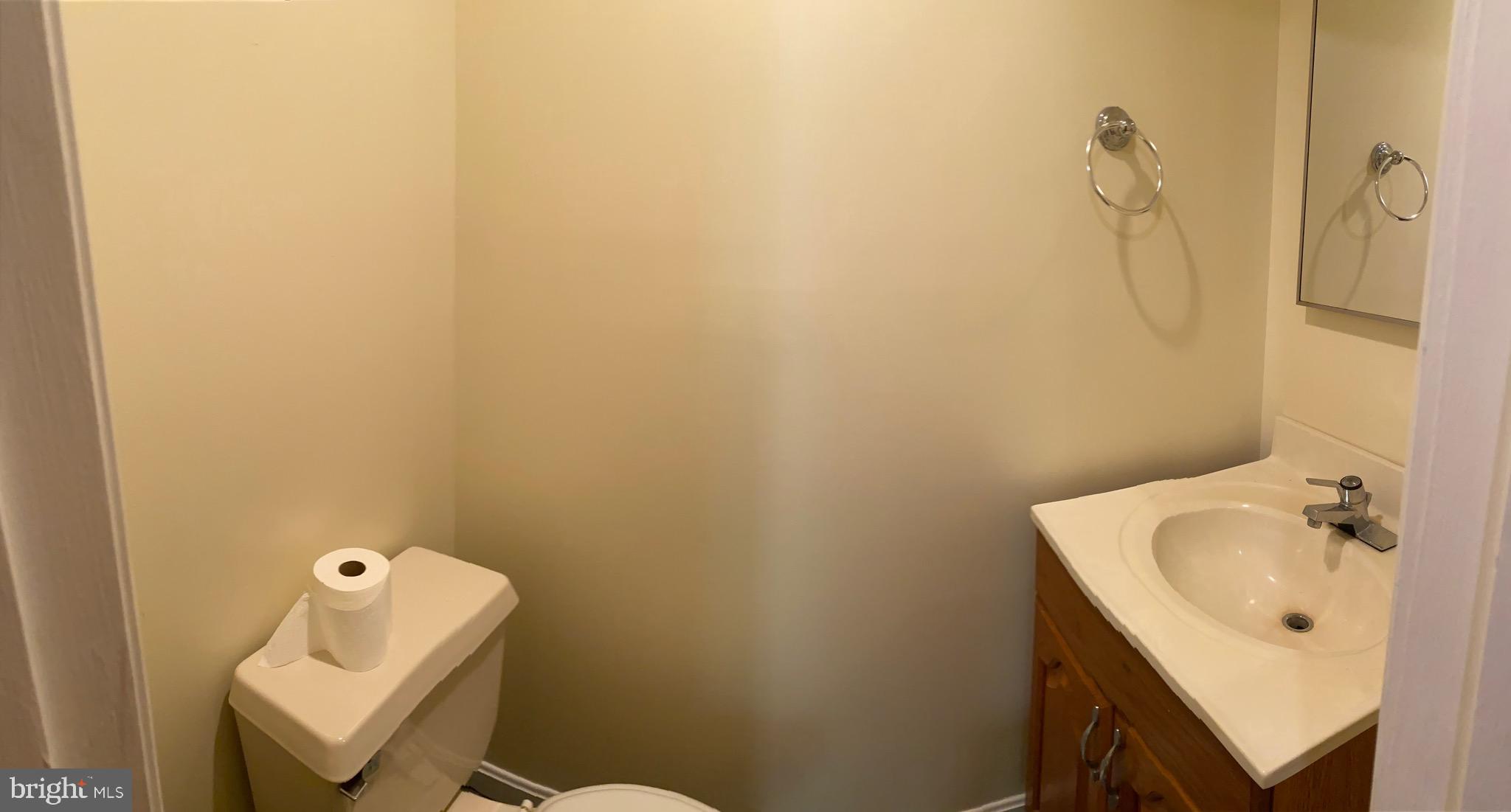 1216 Heathfield Road Eldersburg, MD 21784 - Photo 23 of 26 a bathroom with a sink a toilet and a mirror