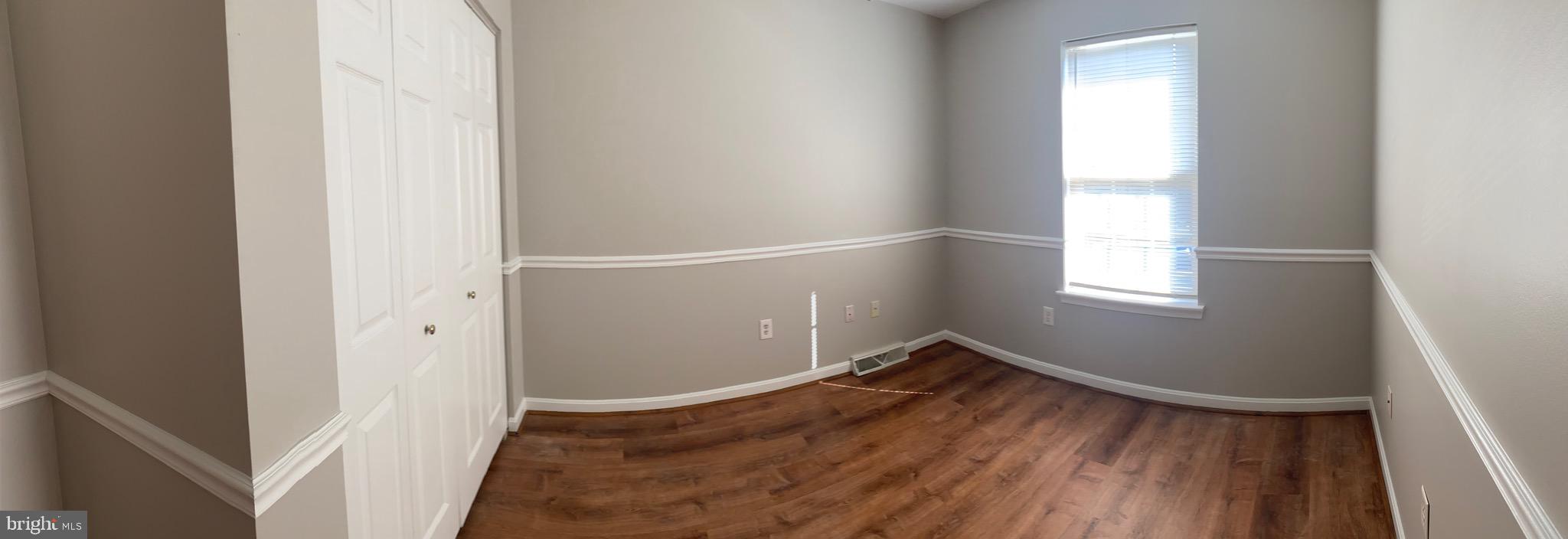 1216 Heathfield Road Eldersburg, MD 21784 - Photo 10 of 26 a view of empty room with wooden floor