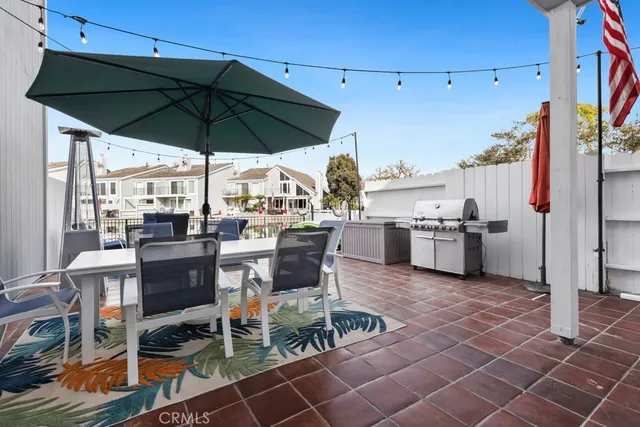 a view of a dinning table and chairs in the patio