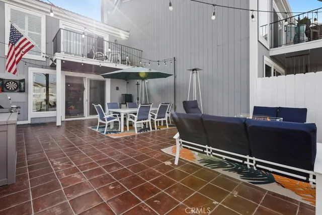 a building outdoor space with patio furniture and potted plants