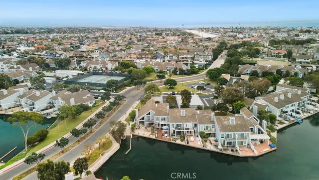 an aerial view of residential building and lake