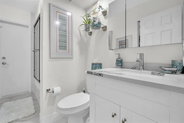 a room with furniture and a potted plant