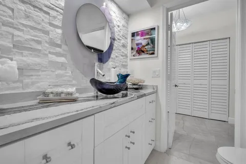 a front view of a house with a yard and a garage