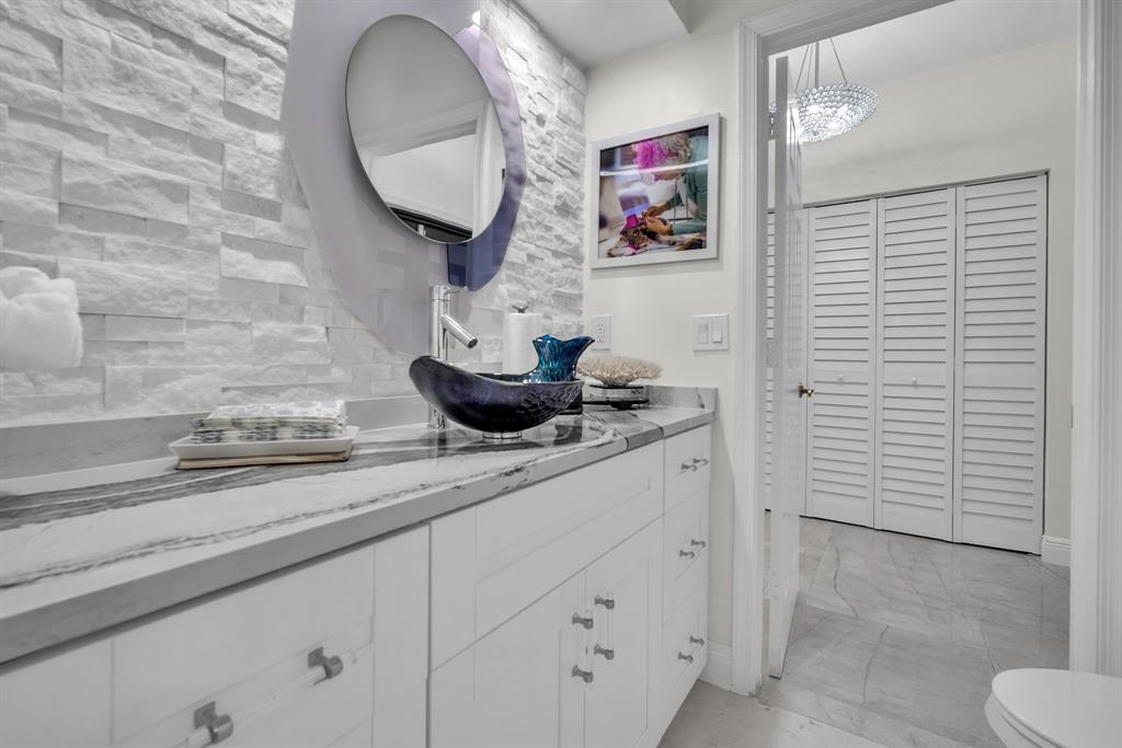 820 Southwest 87th Terrace Plantation, FL 33324 - Photo 14 of 41 a bathroom with a sink and a mirror