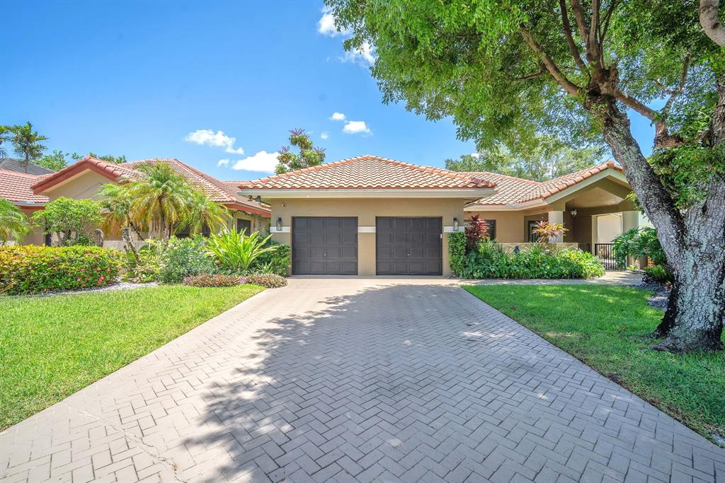 820 Southwest 87th Terrace Plantation, FL 33324 - Photo 20 of 41 a view of a house with a yard and potted plants