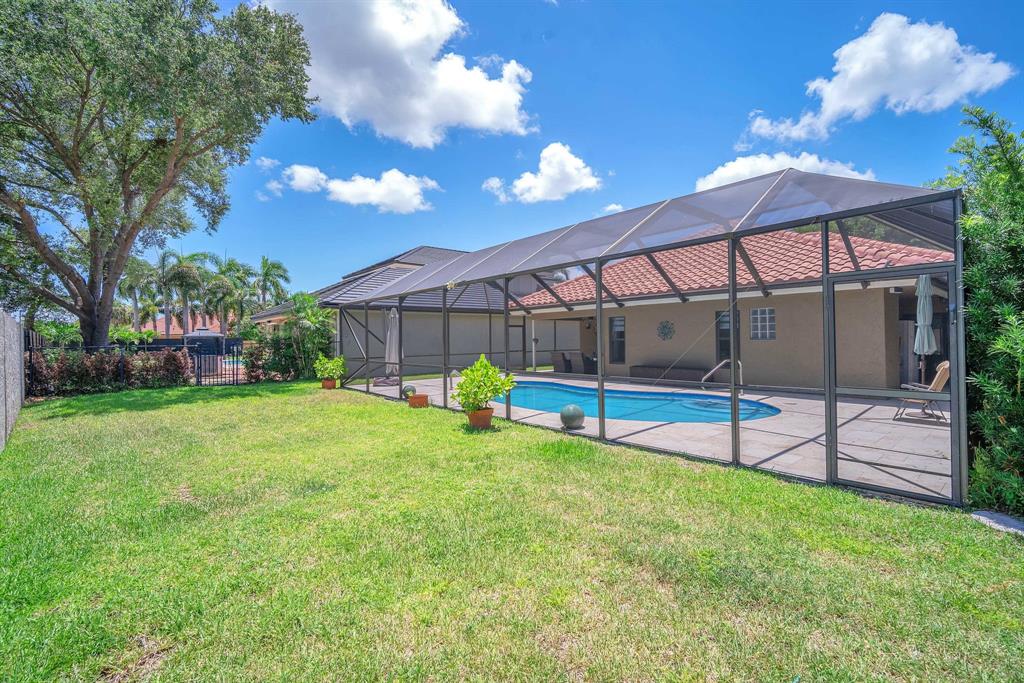 820 Southwest 87th Terrace Plantation, FL 33324 - Photo 21 of 41 a view of a house with a yard and sitting area