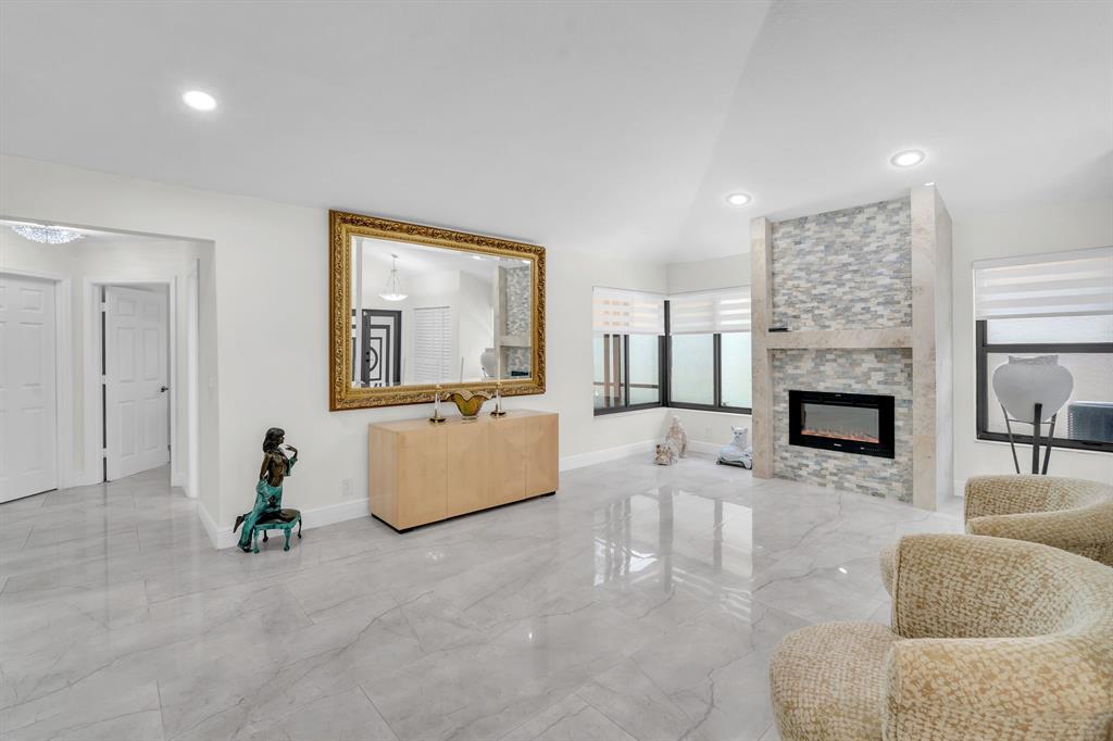 820 Southwest 87th Terrace Plantation, FL 33324 - Photo 24 of 41 a living room with furniture and a fireplace