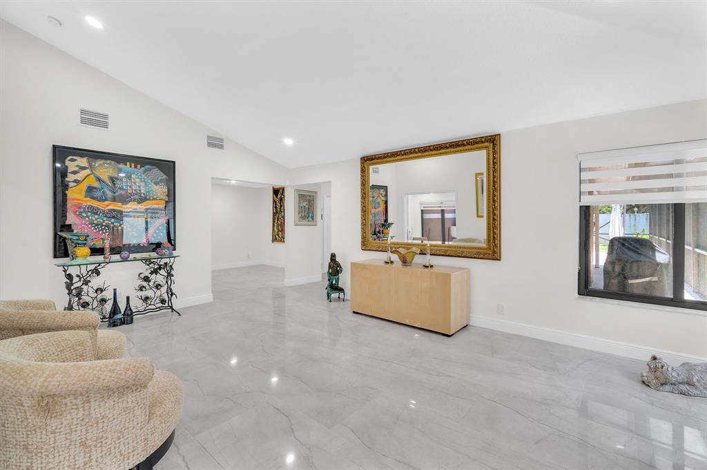 820 Southwest 87th Terrace Plantation, FL 33324 - Photo 25 of 41 a living room with furniture and a flat screen tv