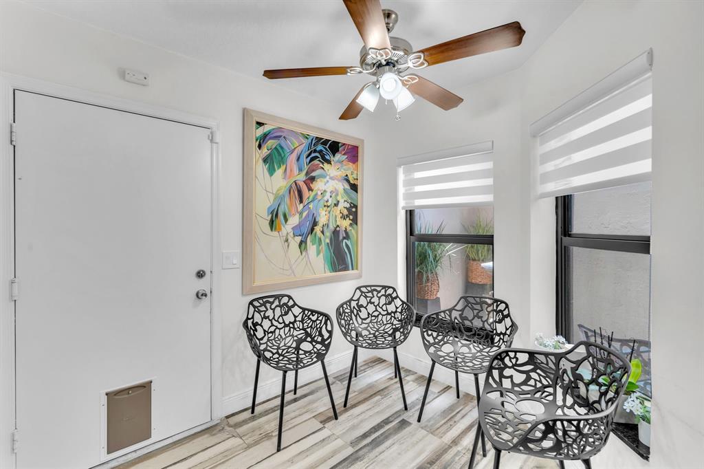 820 Southwest 87th Terrace Plantation, FL 33324 - Photo 28 of 41 a view of a dining room with furniture and a chandelier fan