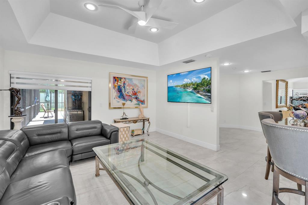 820 Southwest 87th Terrace Plantation, FL 33324 - Photo 29 of 41 a living room with furniture and a flat screen tv