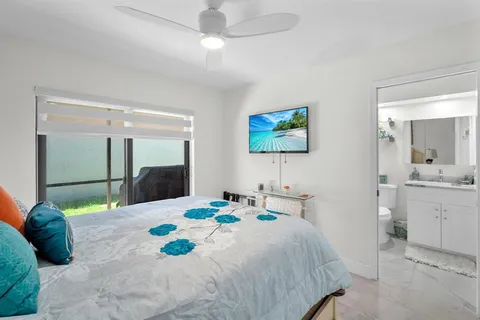 a view of a backyard with swimming pool