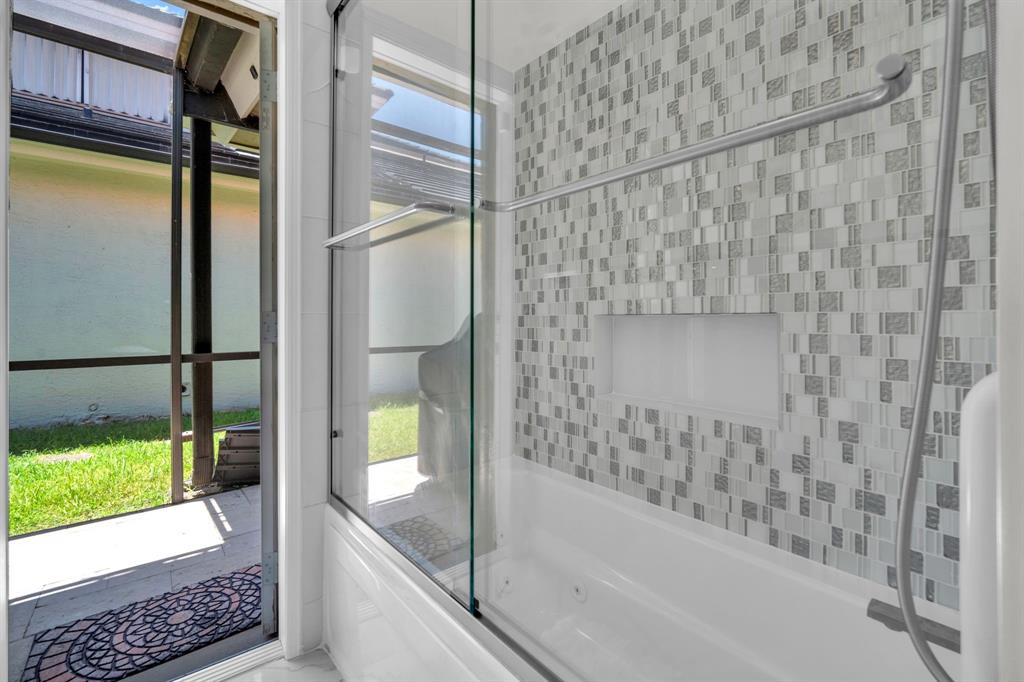 820 Southwest 87th Terrace Plantation, FL 33324 - Photo 34 of 41 a bathroom with a bathtub and shower