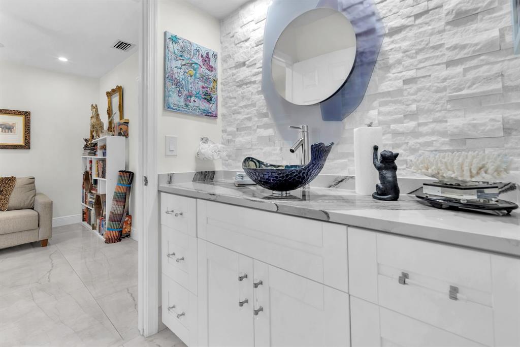 820 Southwest 87th Terrace Plantation, FL 33324 - Photo 35 of 41 a bathroom with a sink and a mirror