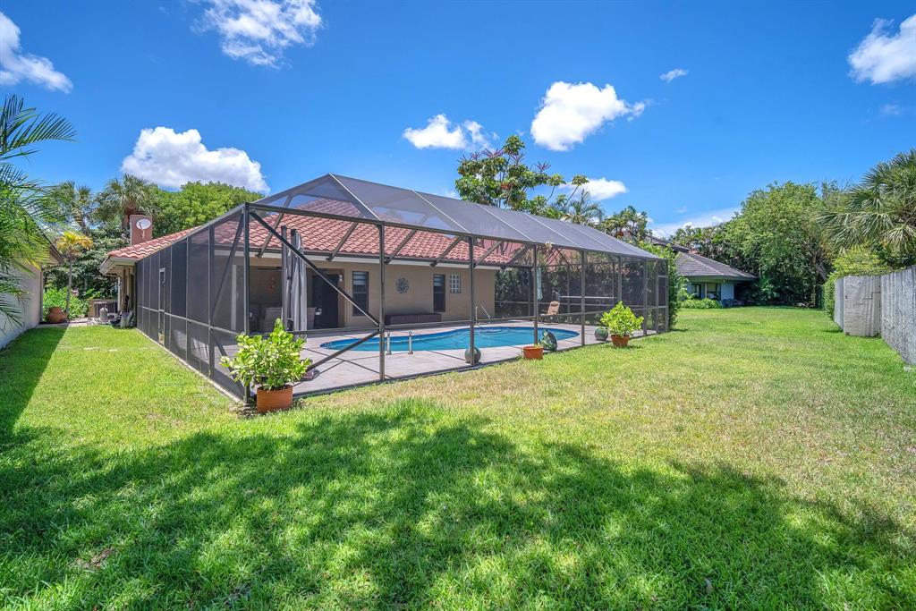820 Southwest 87th Terrace Plantation, FL 33324 - Photo 40 of 41 a view of a house with a yard and a garden
