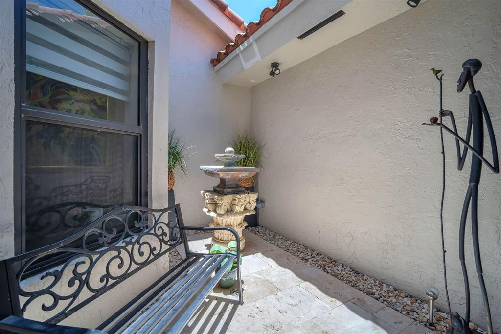 820 Southwest 87th Terrace Plantation, FL 33324 - Photo 6 of 41 a bedroom with a bed and a window