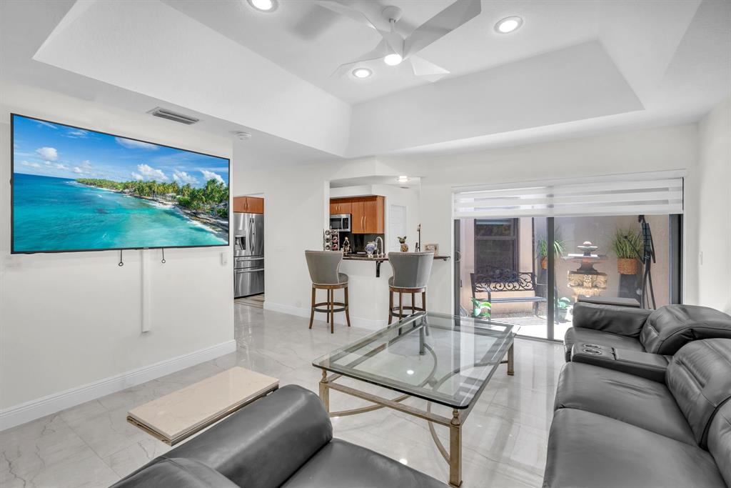 820 Southwest 87th Terrace Plantation, FL 33324 - Photo 8 of 41 a living room with furniture and a flat screen tv