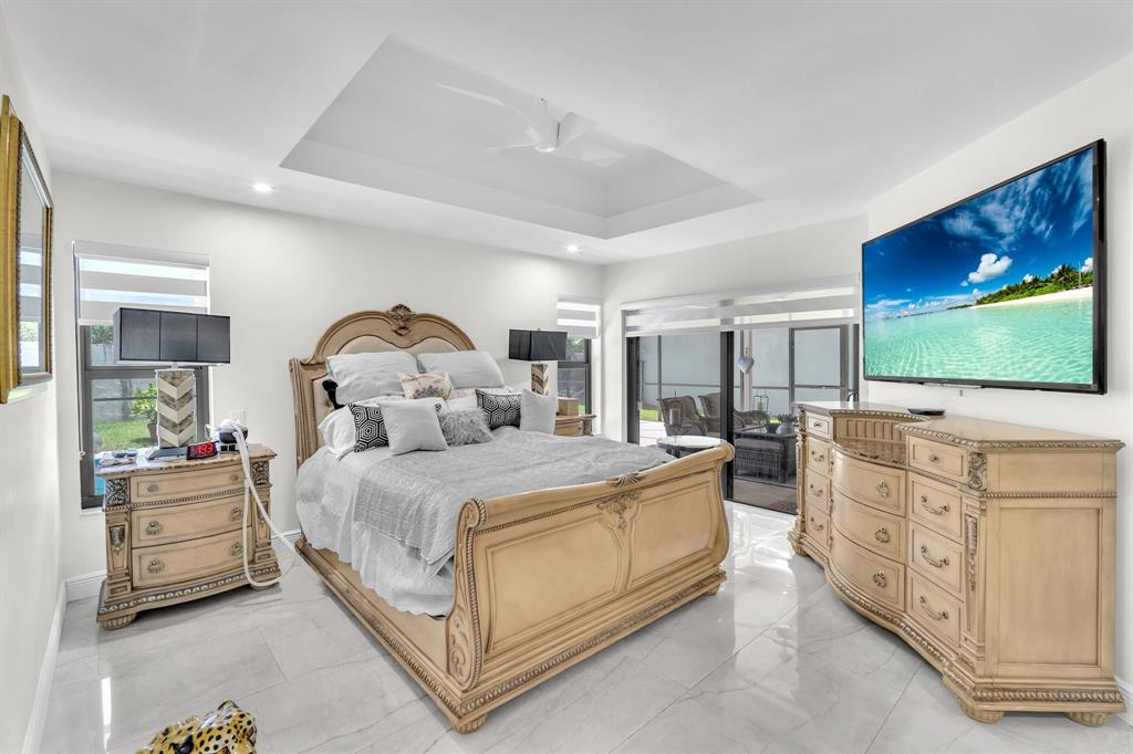 820 Southwest 87th Terrace Plantation, FL 33324 - Photo 9 of 41 a living room with furniture and a flat screen tv