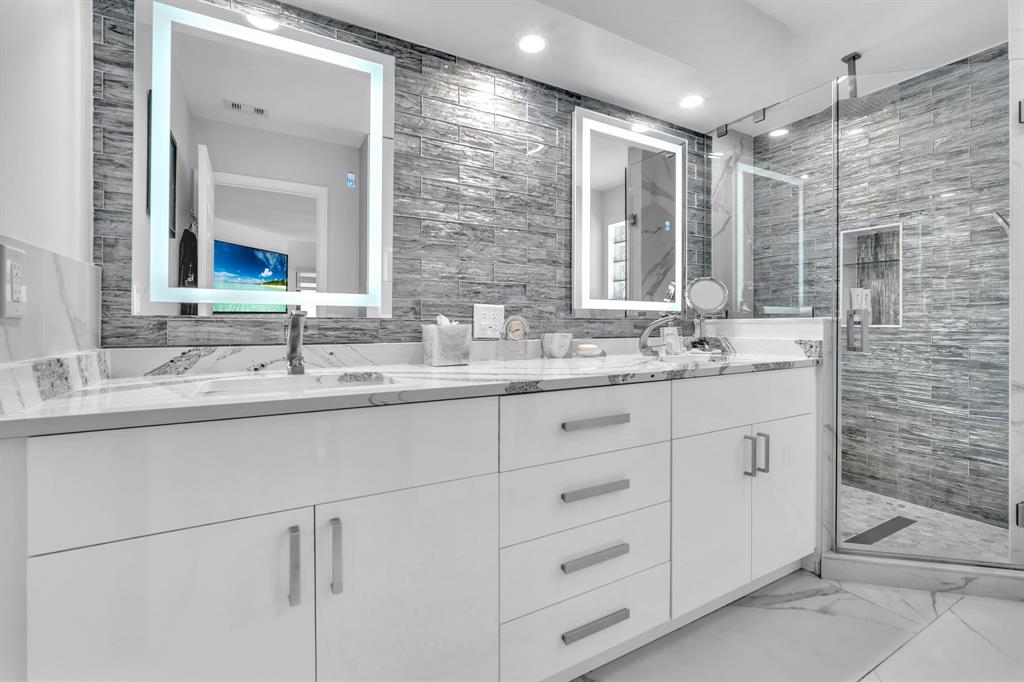 820 Southwest 87th Terrace Plantation, FL 33324 - Photo 10 of 41 a bathroom with double sink and a mirror