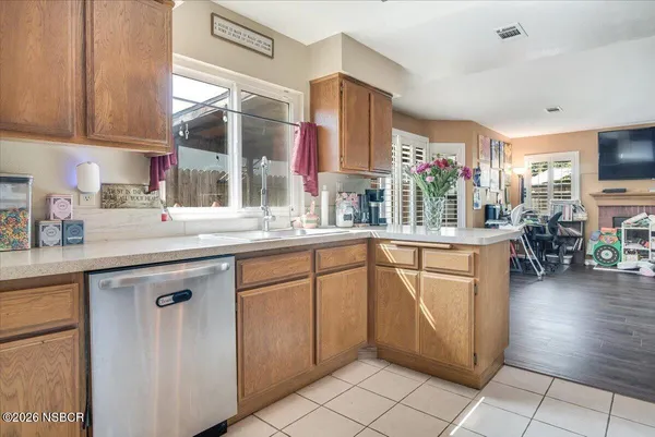 a kitchen with stainless steel appliances granite countertop a sink and cabinets