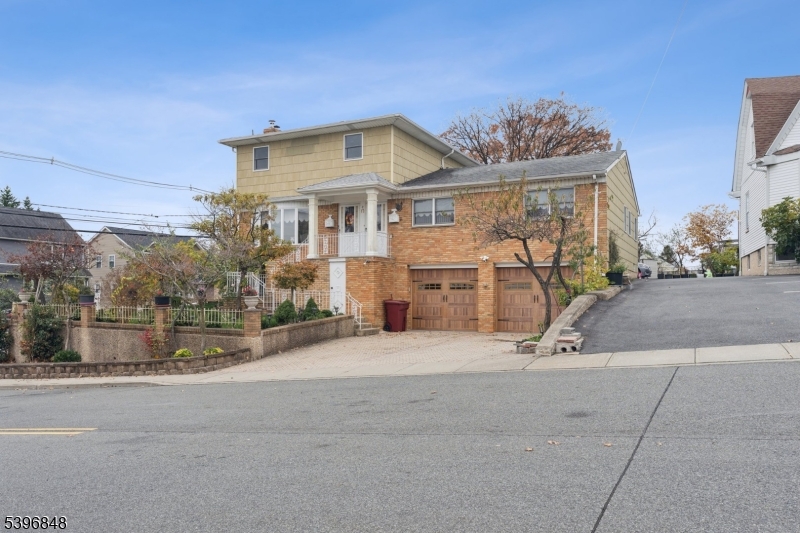 front view of a house with a garden