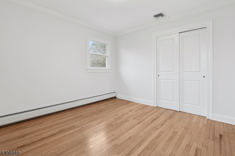 3 Witherspoon Street, Unit 2 Nutley, NJ 07110 - Photo 11 of 19 a view of an empty room with wooden floor
