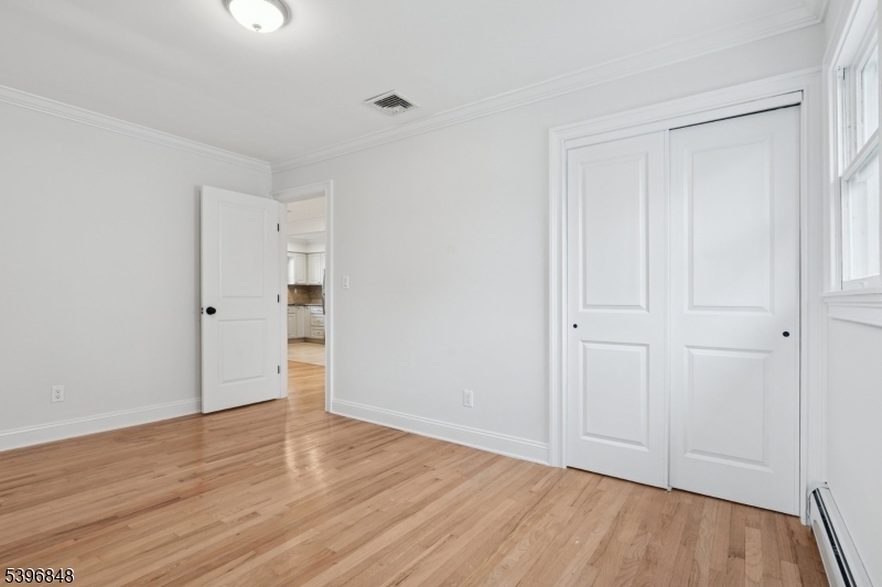 3 Witherspoon Street, Unit 2 Nutley, NJ 07110 - Photo 17 of 19 a view of an empty room with wooden floor